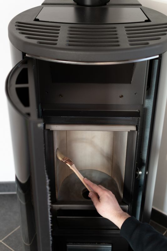 Technician Inspecting Pellet Stove